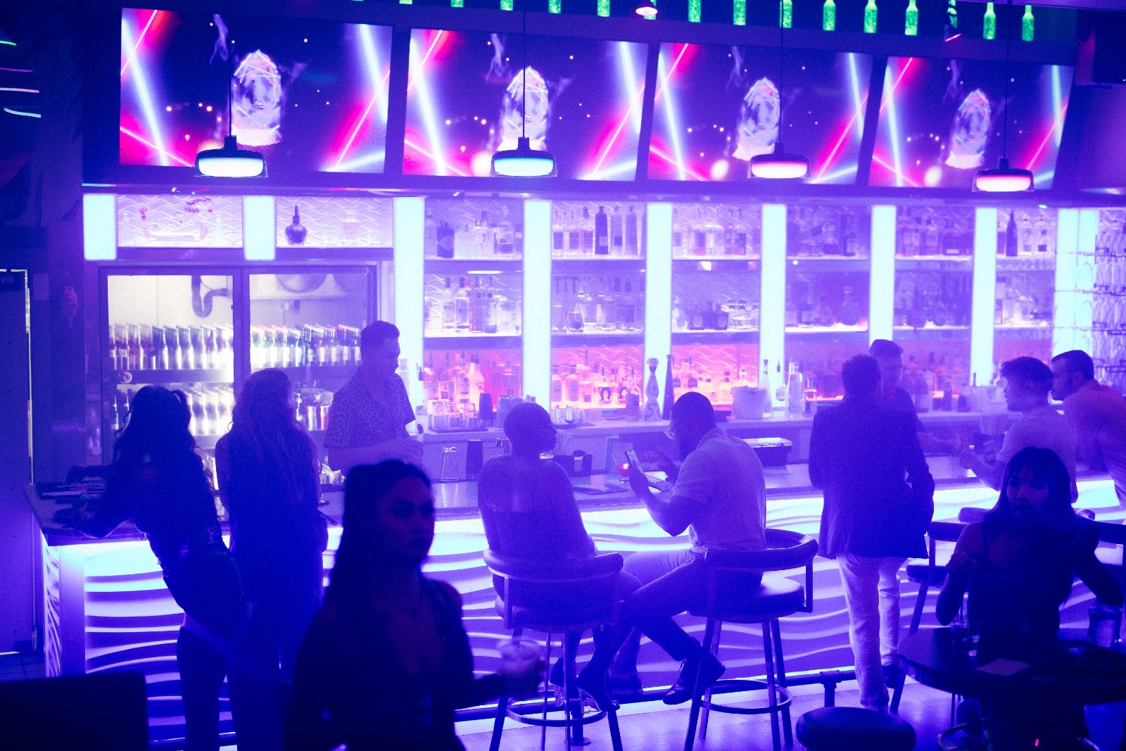 Packed bar and crowd under purple lights at Rendezvous, Korean lounge in Duluth GA
